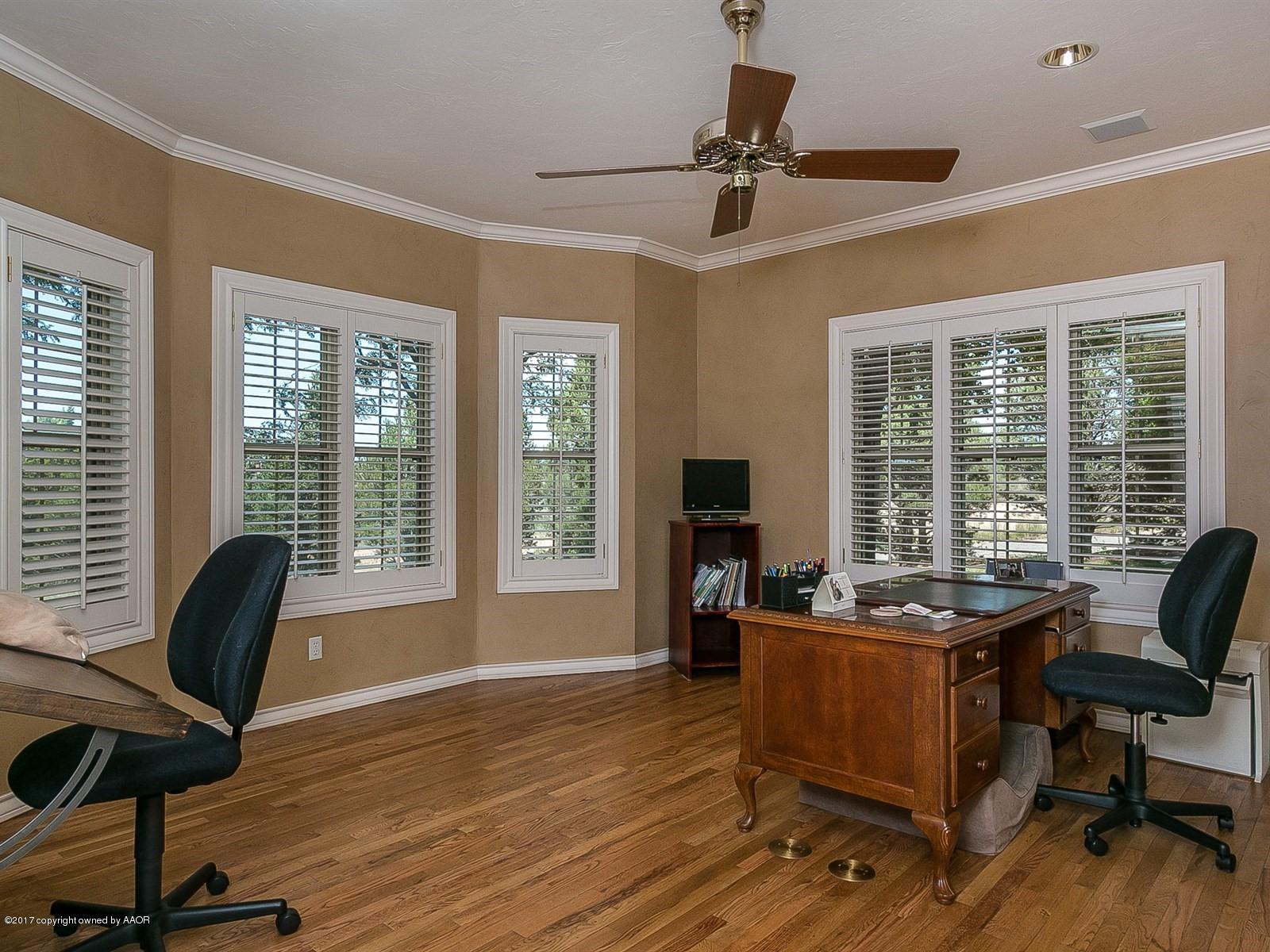 509 Fox Ridge Road Amarillo, TX 79118 - Photo 17 of 55 a view of a workspace with furniture and a window
