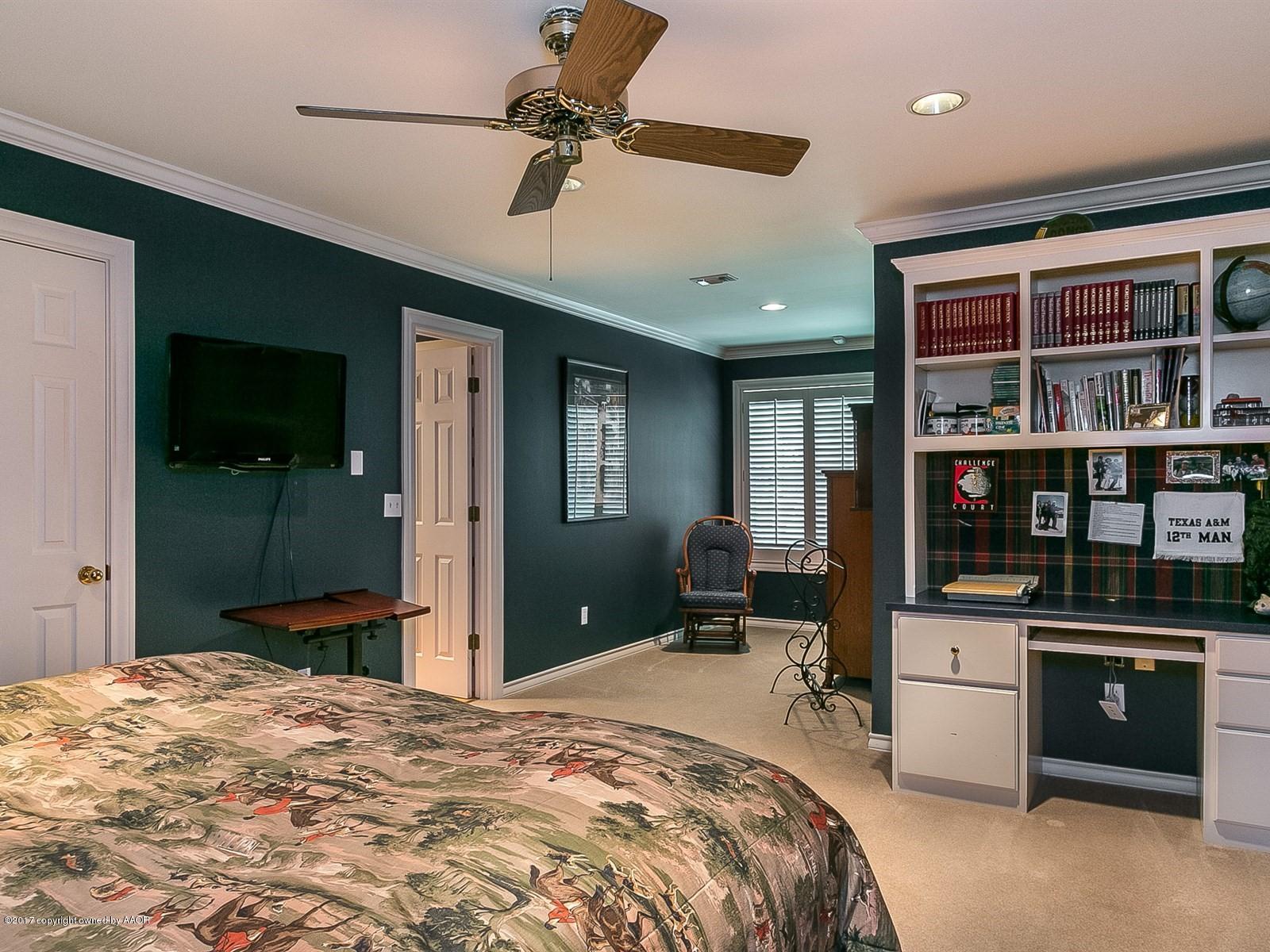 509 Fox Ridge Road Amarillo, TX 79118 - Photo 23 of 55 a bedroom with a bed and a large window