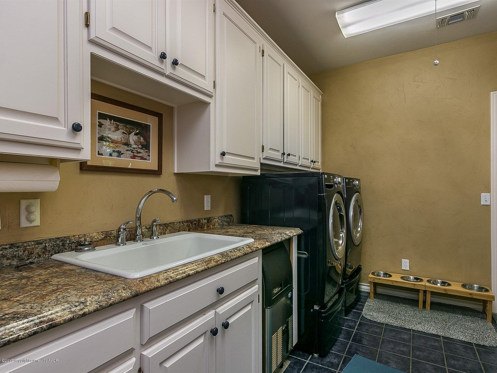 509 Fox Ridge Road Amarillo, TX 79118 - Photo 28 of 55 a kitchen with a sink and cabinets