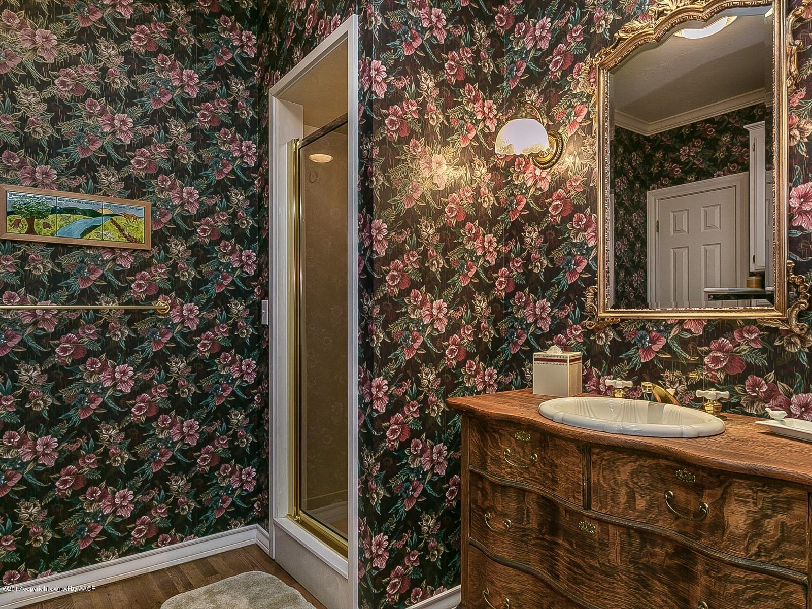 509 Fox Ridge Road Amarillo, TX 79118 - Photo 29 of 55 a bathroom with a sink and mirror