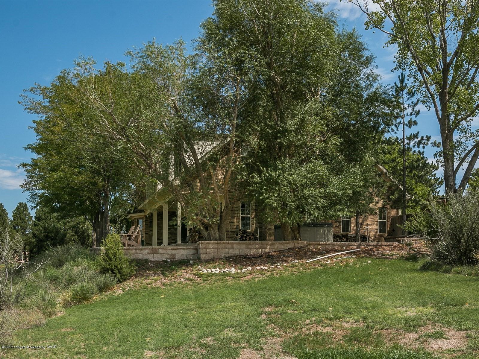 509 Fox Ridge Road Amarillo, TX 79118 - Photo 40 of 55 a view of a backyard with large trees