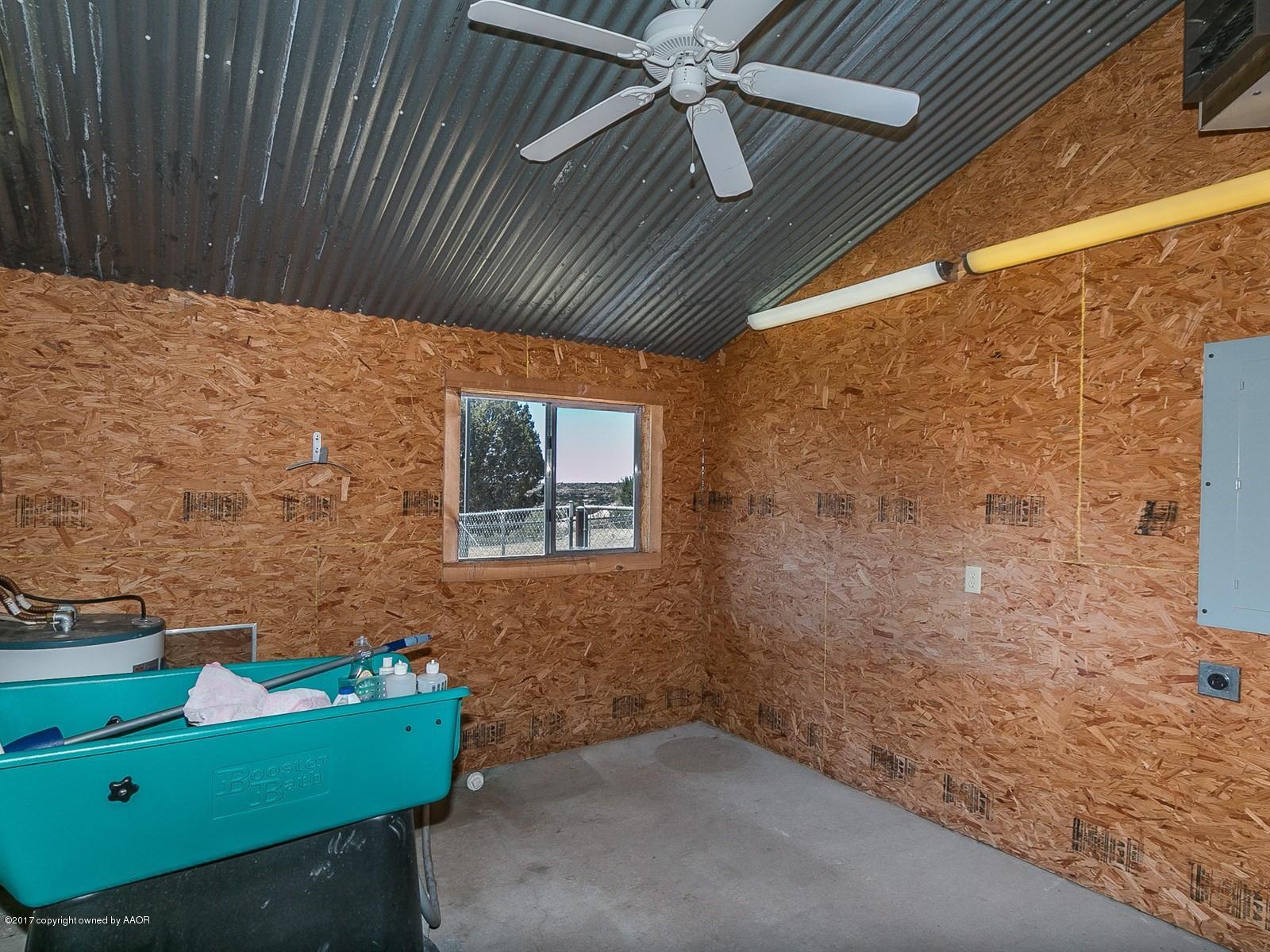 509 Fox Ridge Road Amarillo, TX 79118 - Photo 54 of 55 a view of backyard with a ceiling fan and window