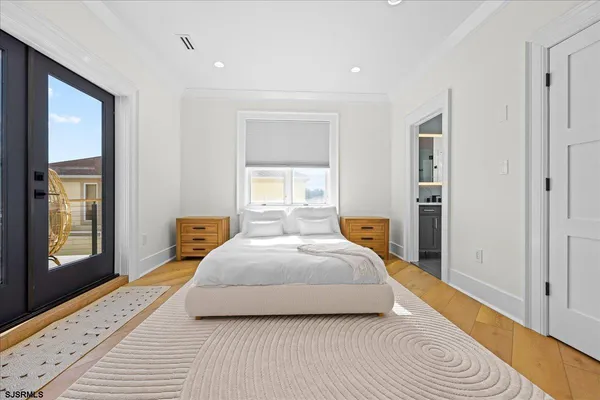 a bed room with a bed and a ceiling fan