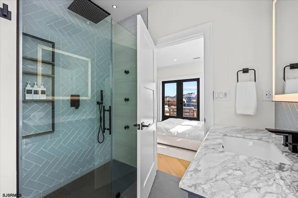 a bedroom with a large bed and a flat screen tv