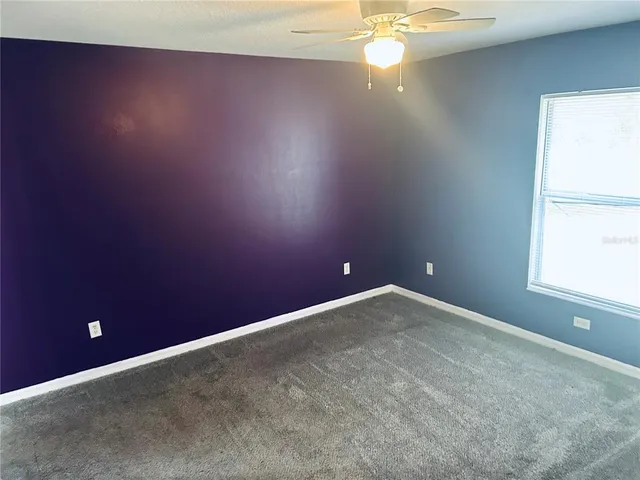 a bed room with a bed and a television