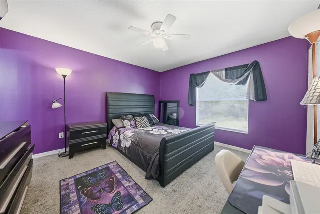 a bed room with furniture and a flat screen tv