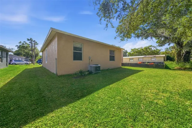 a view of a tree in a yard