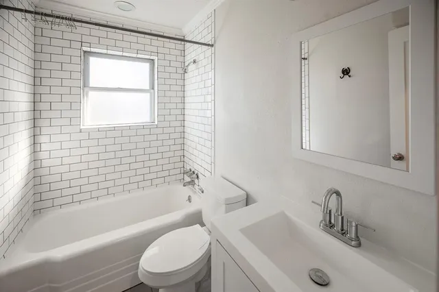 a bathroom with a sink toilet and bathtub