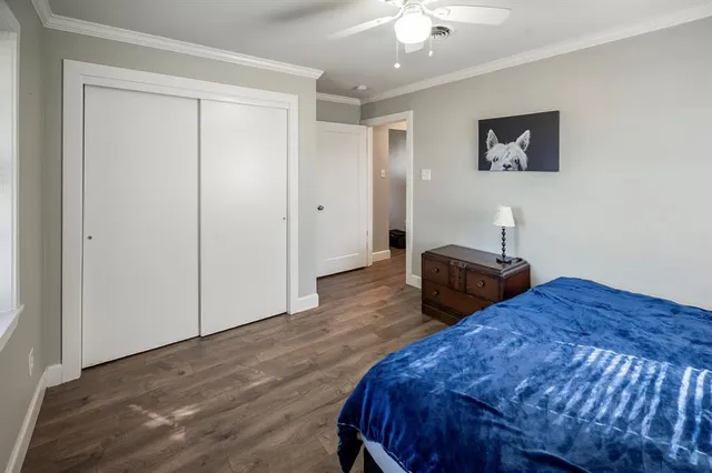 a bedroom with bed and a window