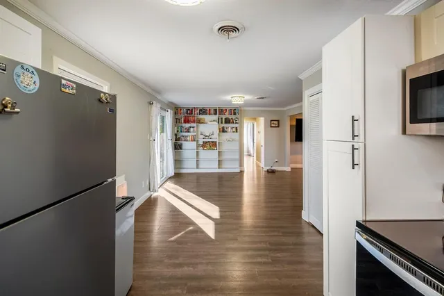 a view of a livingroom with wooden floor