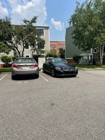 a view of street with parked cars