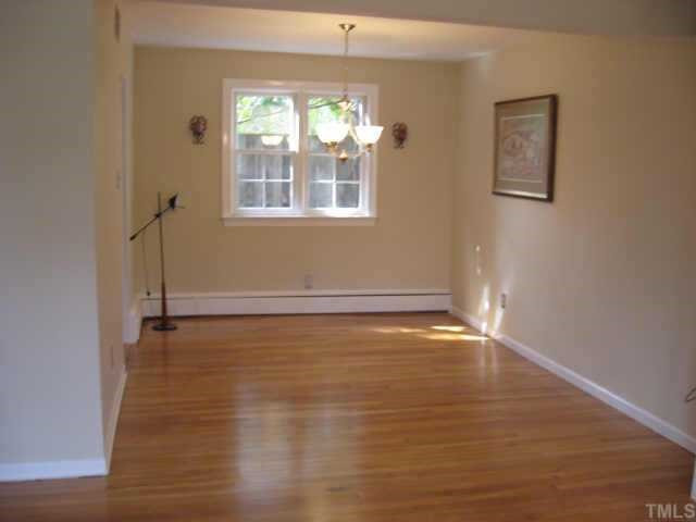 837 Bryan Street Raleigh, NC 27605 - Photo 5 of 11 Dining room with updated light fixture; candle sconces flank rear window...overlooks private courtyard.. Other