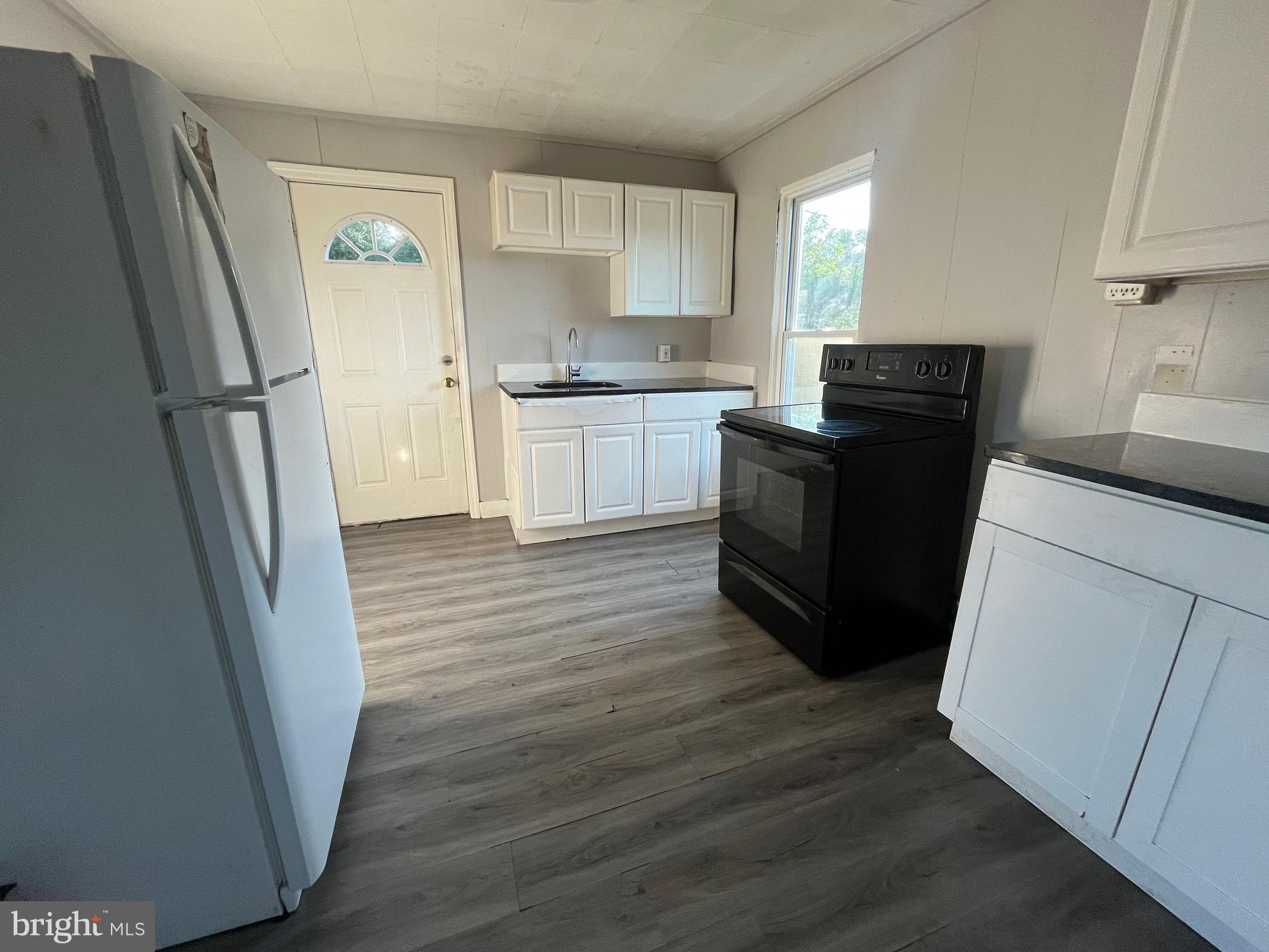 212 Rancocas Road Mount Holly, NJ 08060 - Photo 16 of 27 a kitchen with a refrigerator a sink and dishwasher
