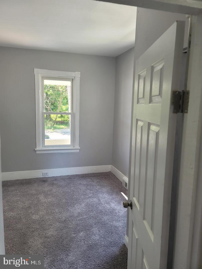 212 Rancocas Road Mount Holly, NJ 08060 - Photo 6 of 27 an empty room with windows