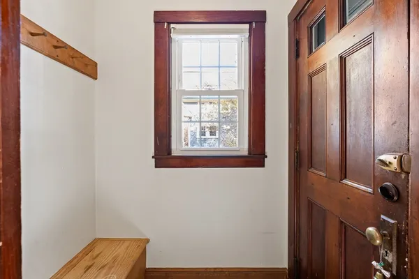 a room with window and cabinet