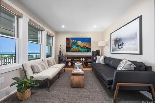 a living room with furniture or couch and a potted plant