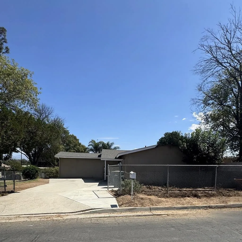 5898 Mountain View Avenue Riverside, CA 92504 - Photo 2 of 7 a swimming pool with buildings in the background