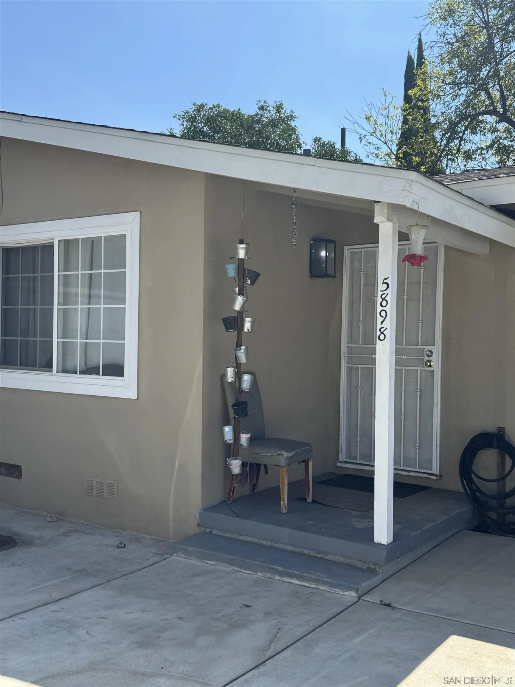 5898 Mountain View Avenue Riverside, CA 92504 - Photo 3 of 7 a view of a porch with a table and chair