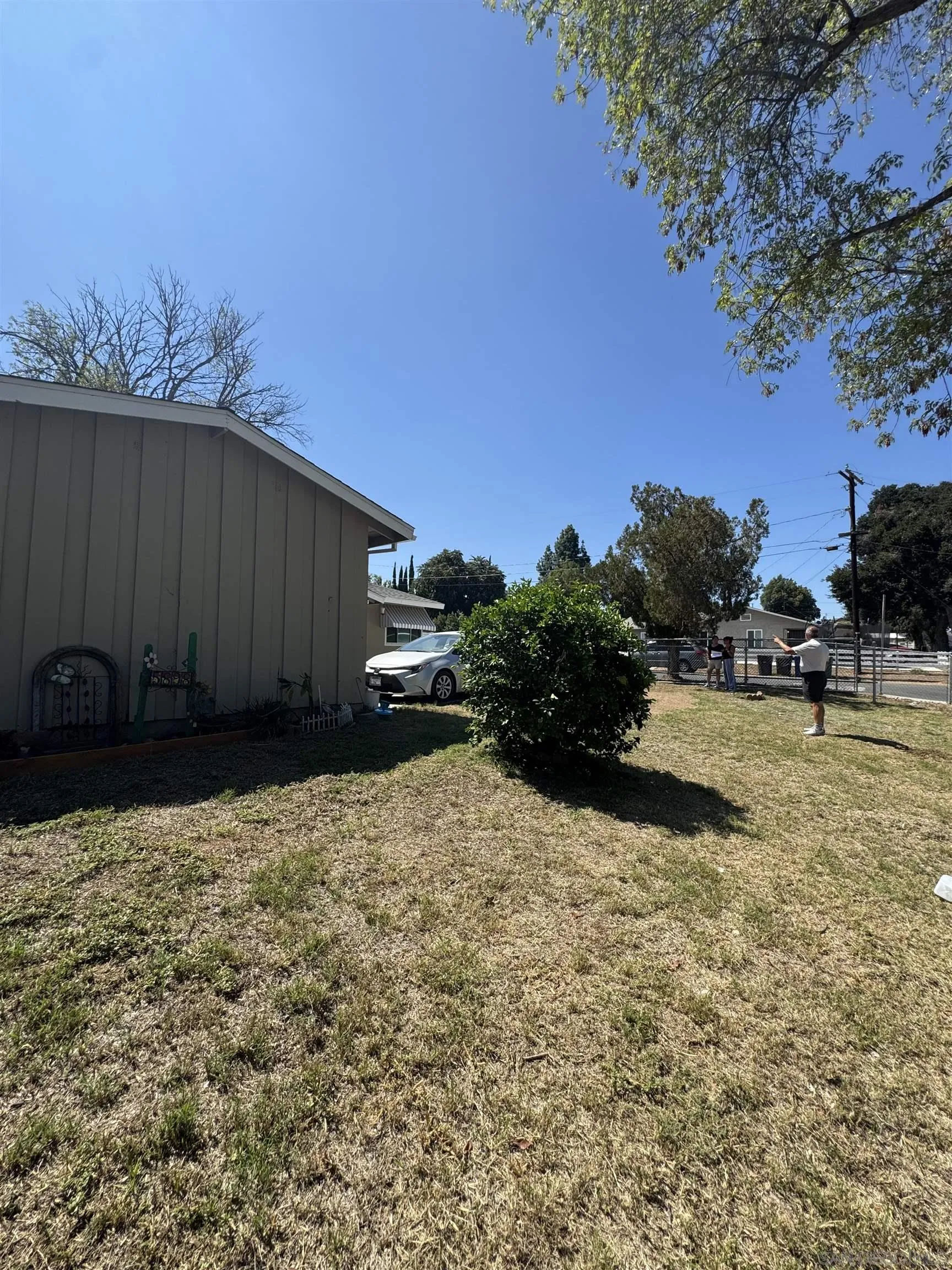 5898 Mountain View Avenue Riverside, CA 92504 - Photo 7 of 7 a street view with wooden fence