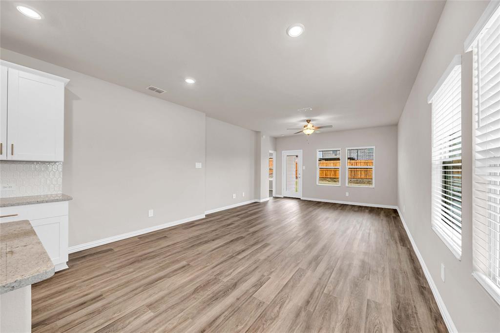 417 Martell Road Lowry Crossing, TX 75069 - Photo 25 of 29 an empty room with wooden floor and windows