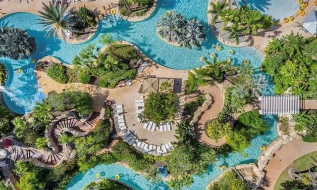 an aerial view of a house with a yard and garden
