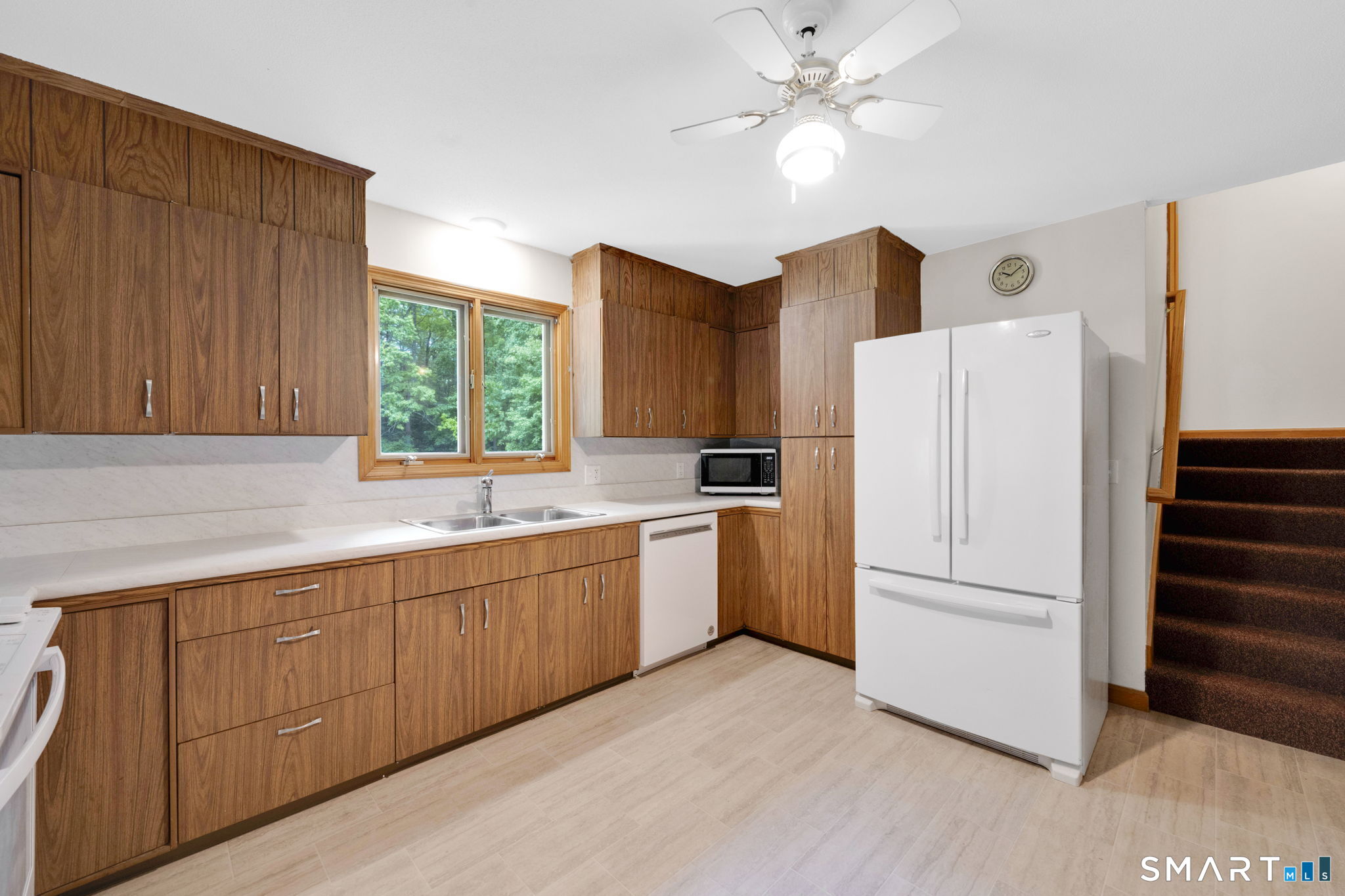 158 Notch Road Granby, CT 06035 - Photo 8 of 40 a kitchen with stainless steel appliances a refrigerator sink and cabinets