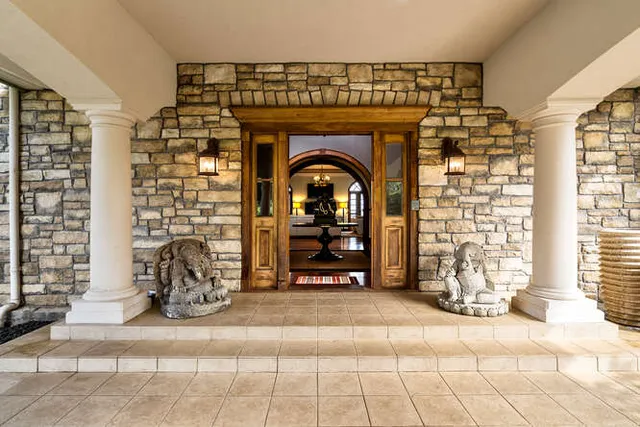 a view of a livingroom with furniture a fireplace