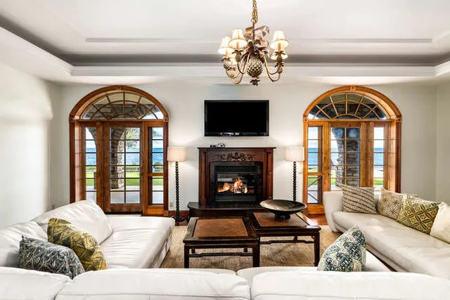 a living room with furniture and a fireplace