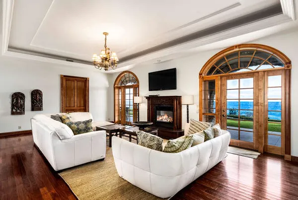a living room with lots of furniture and a large window