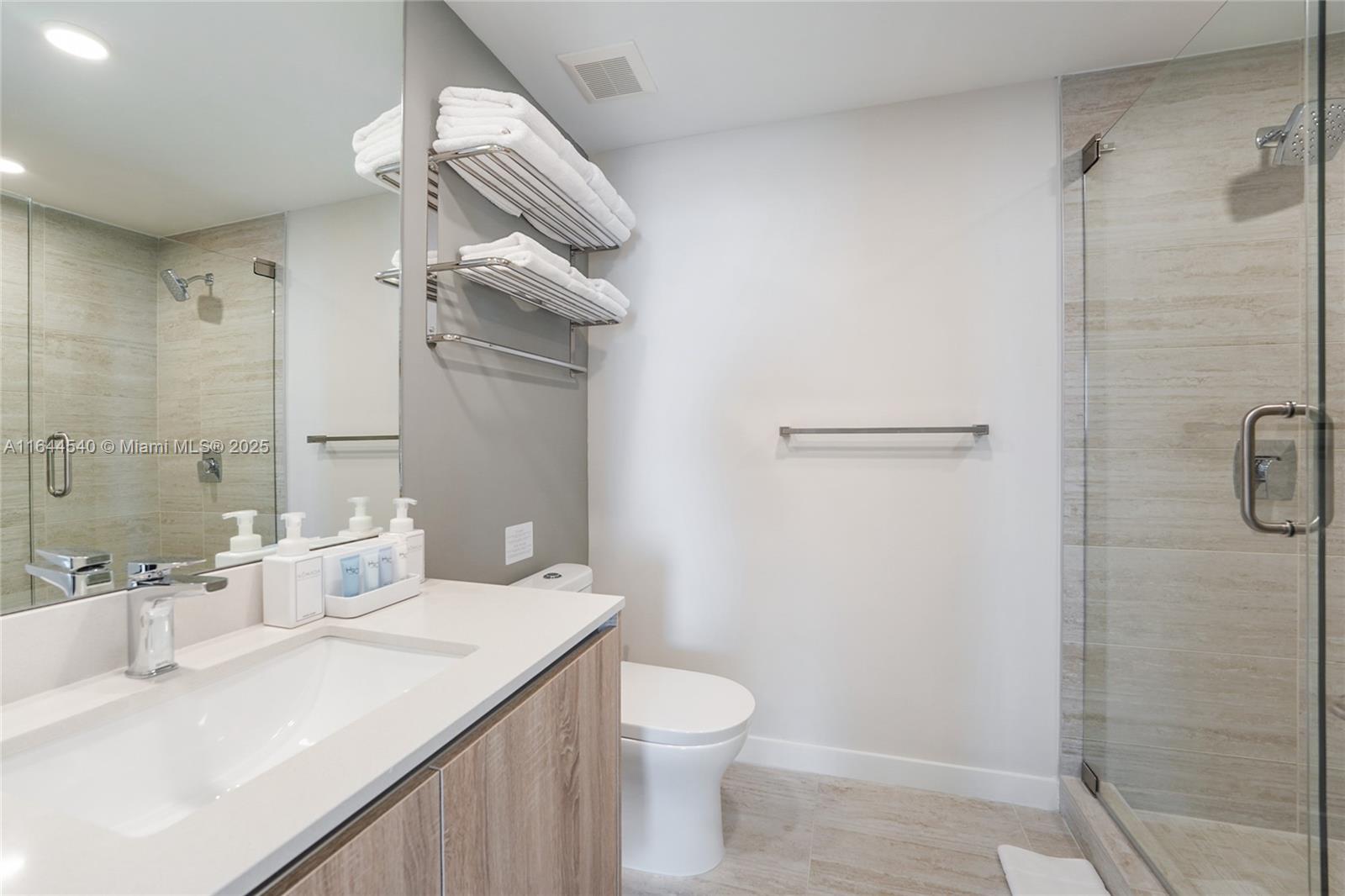 3900 Biscayne Boulevard, Unit S702 Miami, FL 33137 - Photo 10 of 12 a bathroom with a sink toilet and shower