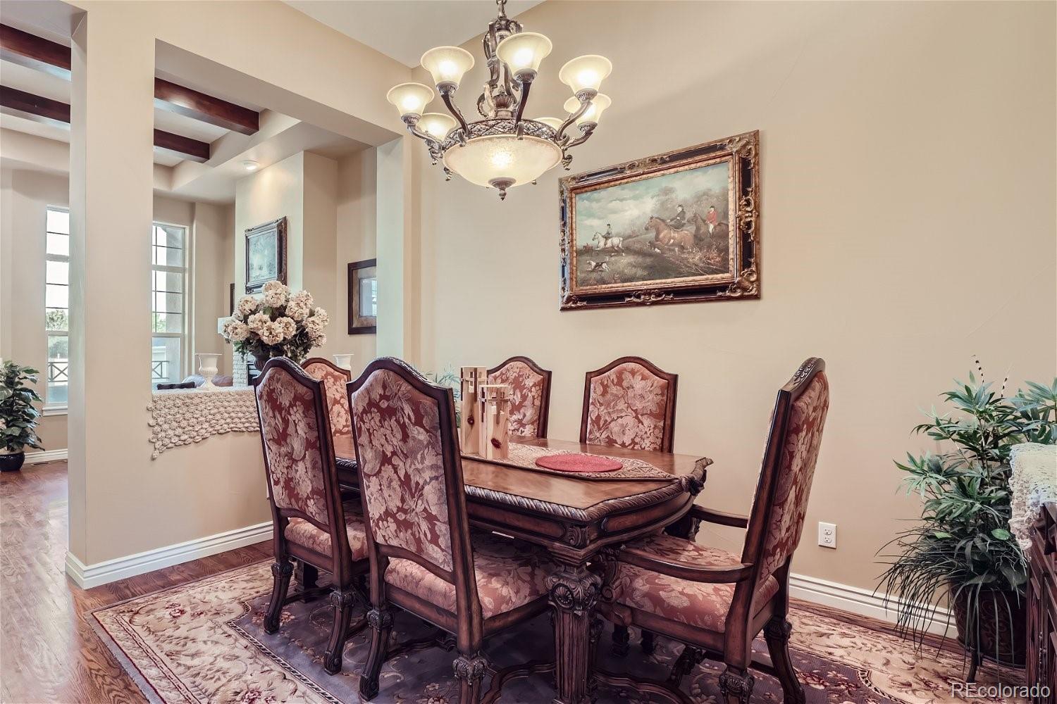10104 Inverness Main Street Englewood, CO 80112 - Photo 16 of 34 a view of a dining room with furniture and wooden floor