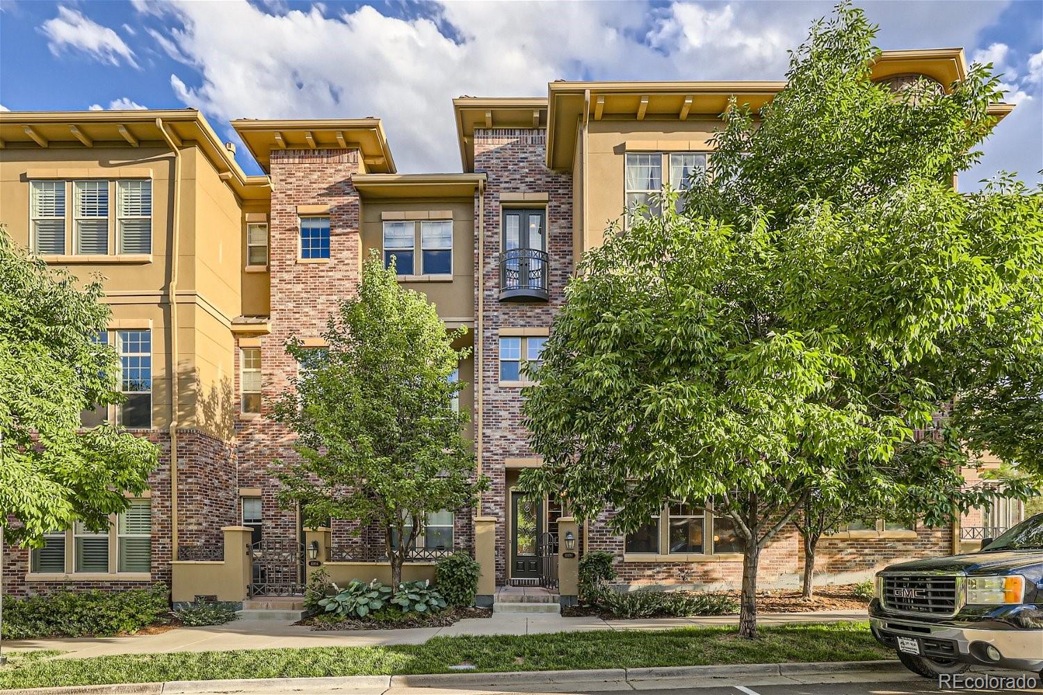 10104 Inverness Main Street Englewood, CO 80112 - Photo 27 of 34 a front view of a residential apartment building with a yard