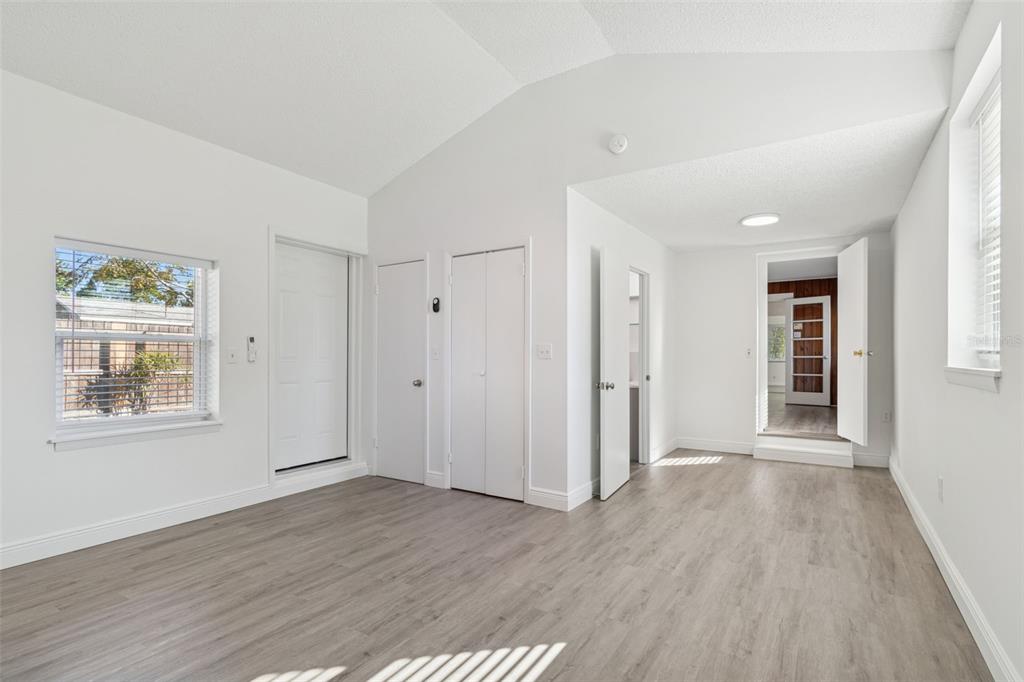 2900 49th Street North St. Petersburg, FL 33710 - Photo 17 of 52 an empty room with wooden floor and windows
