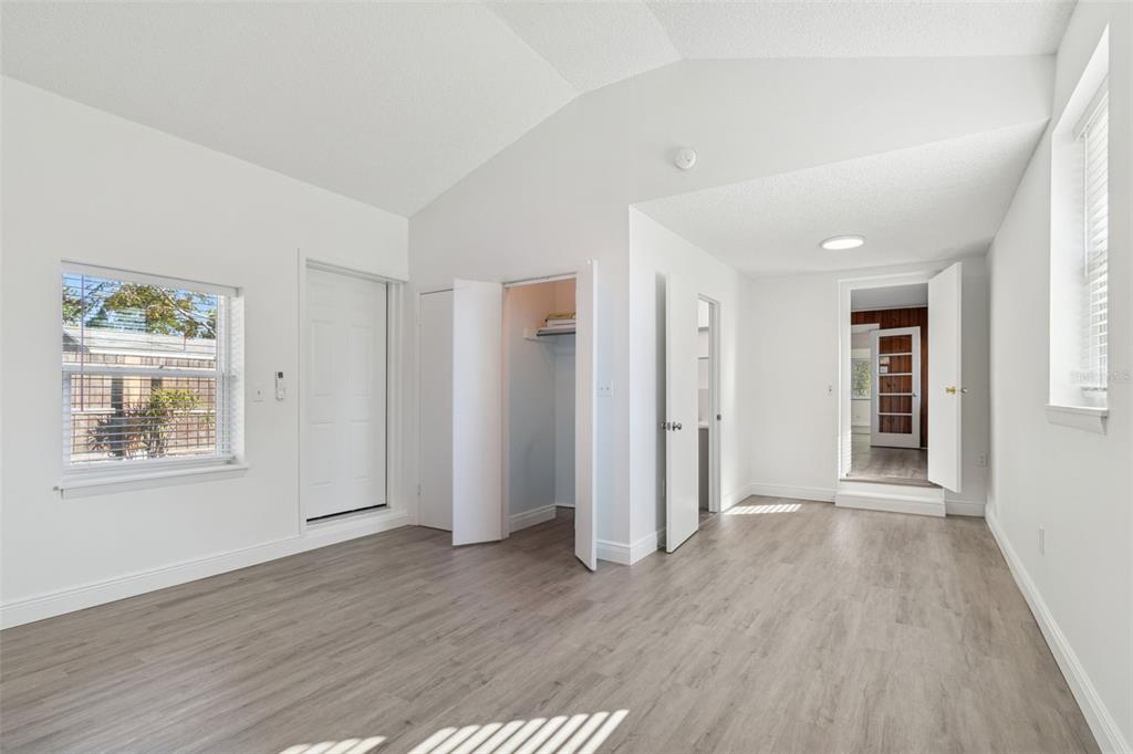2900 49th Street North St. Petersburg, FL 33710 - Photo 18 of 52 an empty room with wooden floor and windows