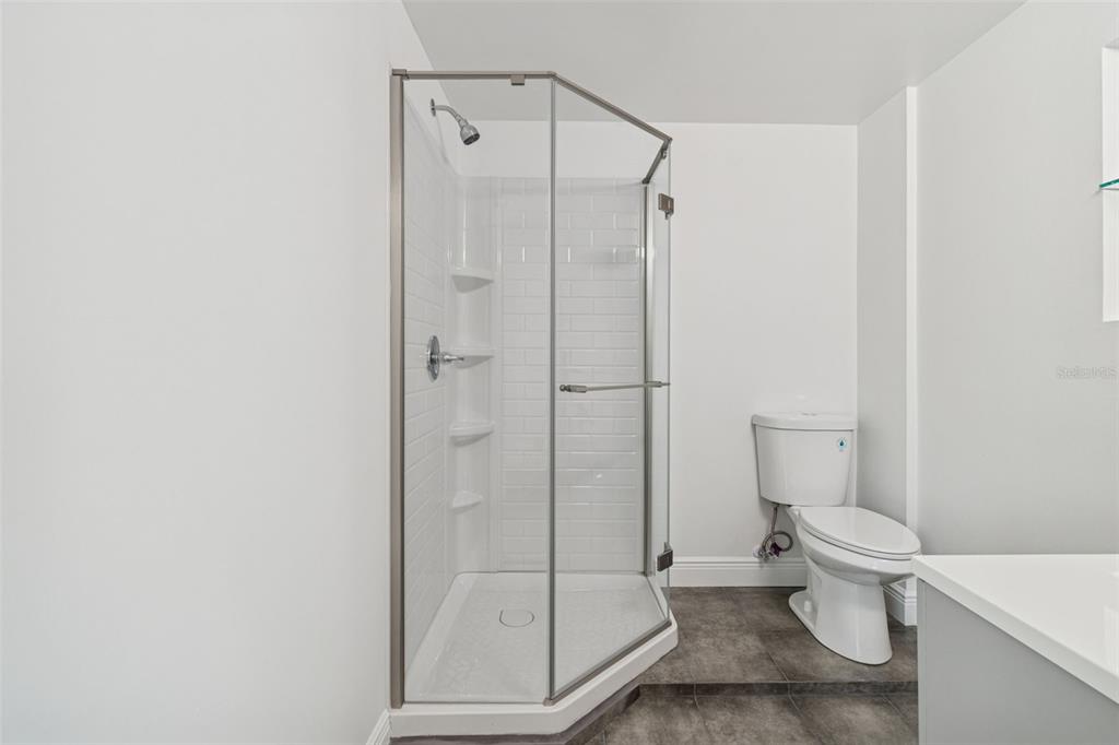 2900 49th Street North St. Petersburg, FL 33710 - Photo 20 of 52 a bathroom with a toilet and a shower