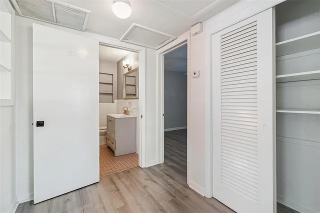 a bathroom with a sink toilet and mirror