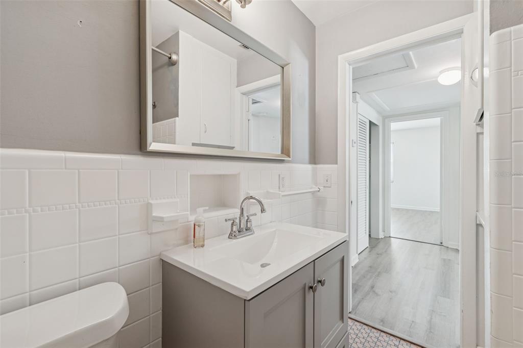 2900 49th Street North St. Petersburg, FL 33710 - Photo 25 of 52 a bathroom with a sink toilet and mirror