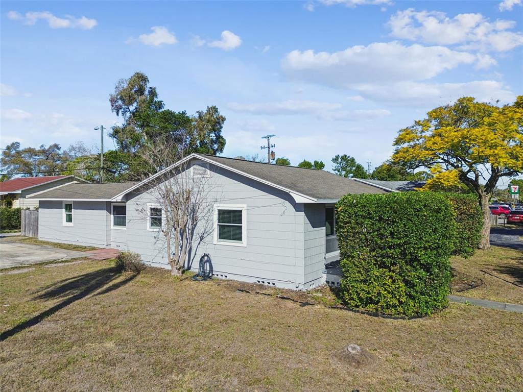 2900 49th Street North St. Petersburg, FL 33710 - Photo 3 of 52 a view of a house with a backyard and a tree