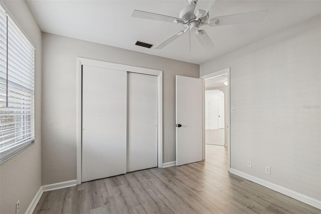 2900 49th Street North St. Petersburg, FL 33710 - Photo 33 of 52 an empty room with fan and windows