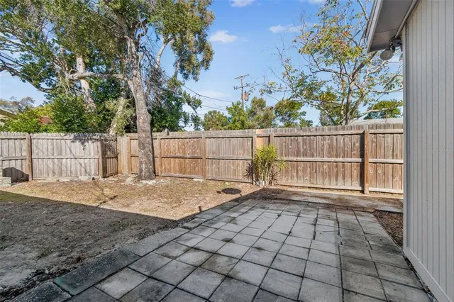 a view of a house with a backyard