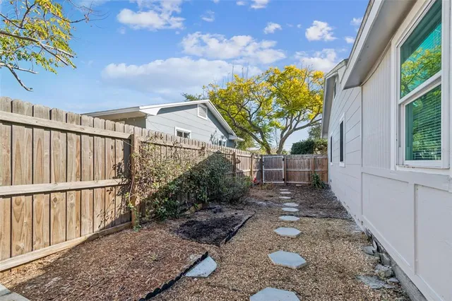 a view of a house with a yard and garage