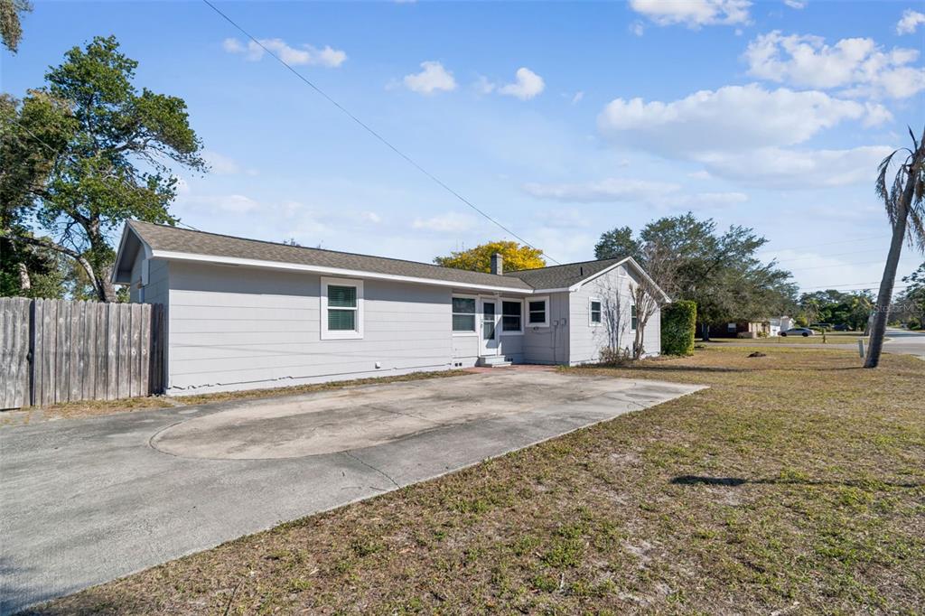 2900 49th Street North St. Petersburg, FL 33710 - Photo 43 of 52 a front view of a house with a yard and garage