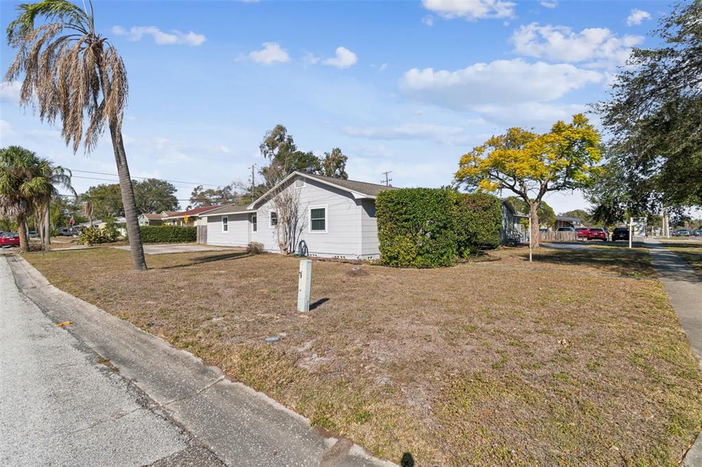 2900 49th Street North St. Petersburg, FL 33710 - Photo 45 of 52 a view of a house with a yard and garage