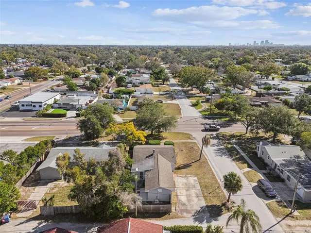 an aerial view of residential houses with outdoor space