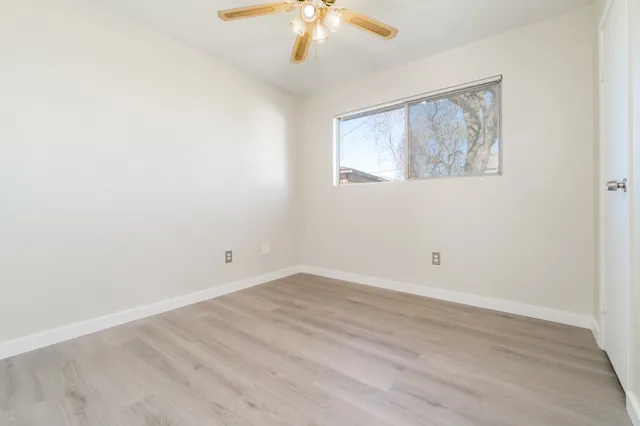 a bathroom with a sink a toilet and a window