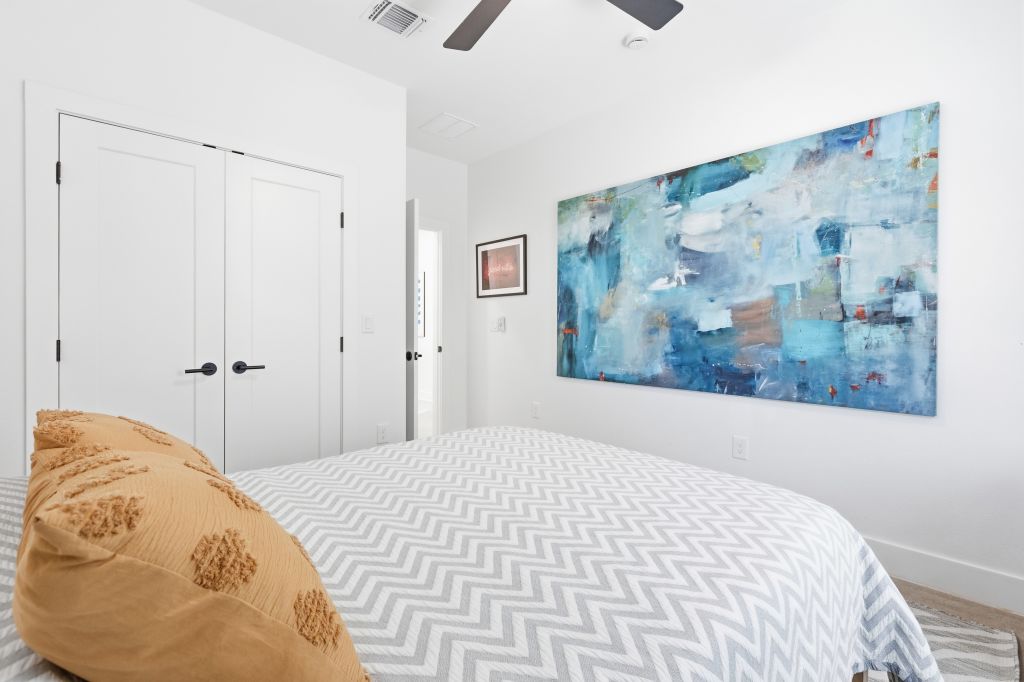 3112 Powell Circle Austin, TX 78704 - Photo 10 of 27 Bedroom with a closet and ceiling fan