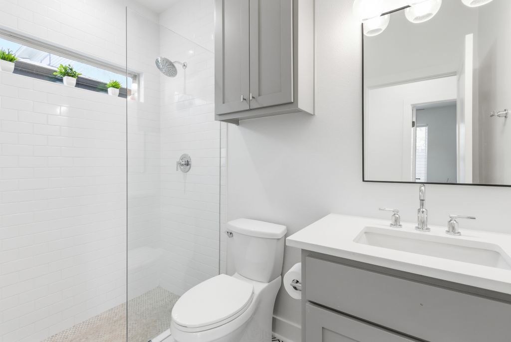 3112 Powell Circle Austin, TX 78704 - Photo 11 of 27 Full bathroom with vanity and walk in shower
