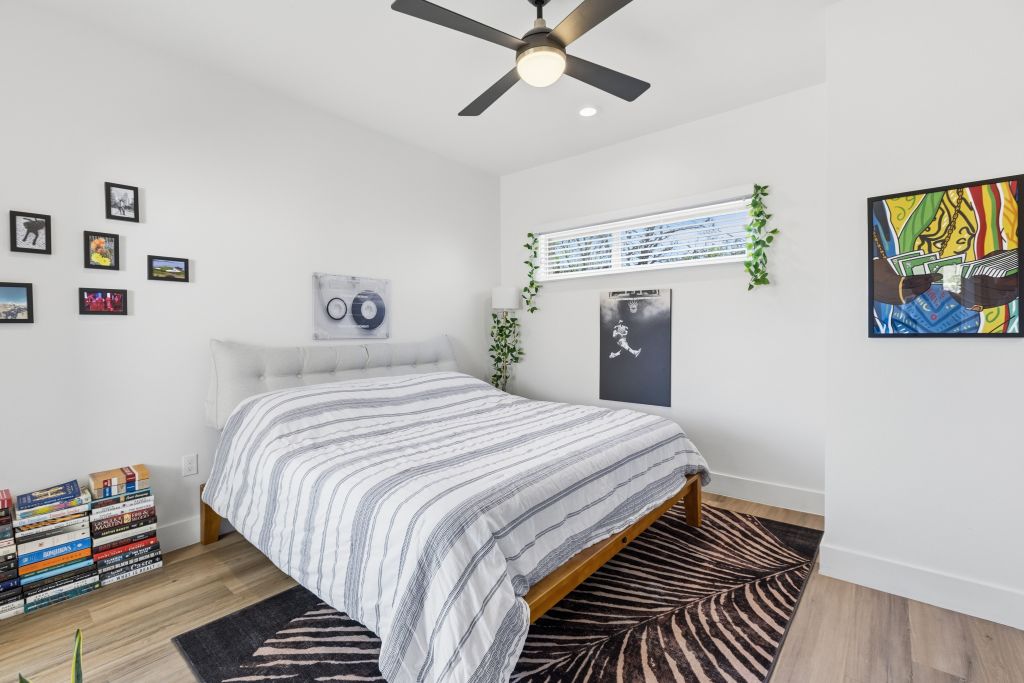 3112 Powell Circle Austin, TX 78704 - Photo 14 of 27 Bedroom featuring light wood-type flooring, ceiling fan, and recessed lighting