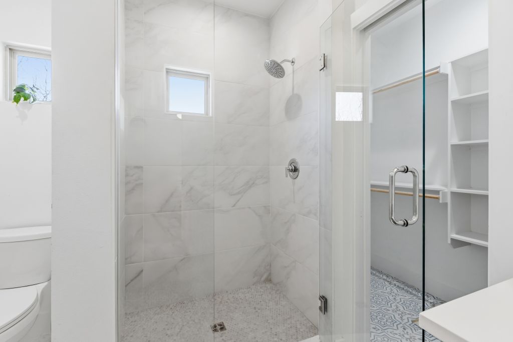 3112 Powell Circle Austin, TX 78704 - Photo 18 of 27 Bathroom featuring a shower stall and vanity