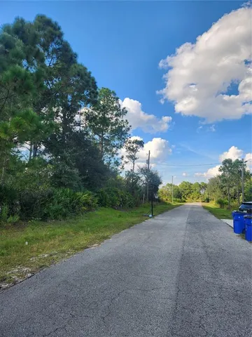 a view of a field with a big yard